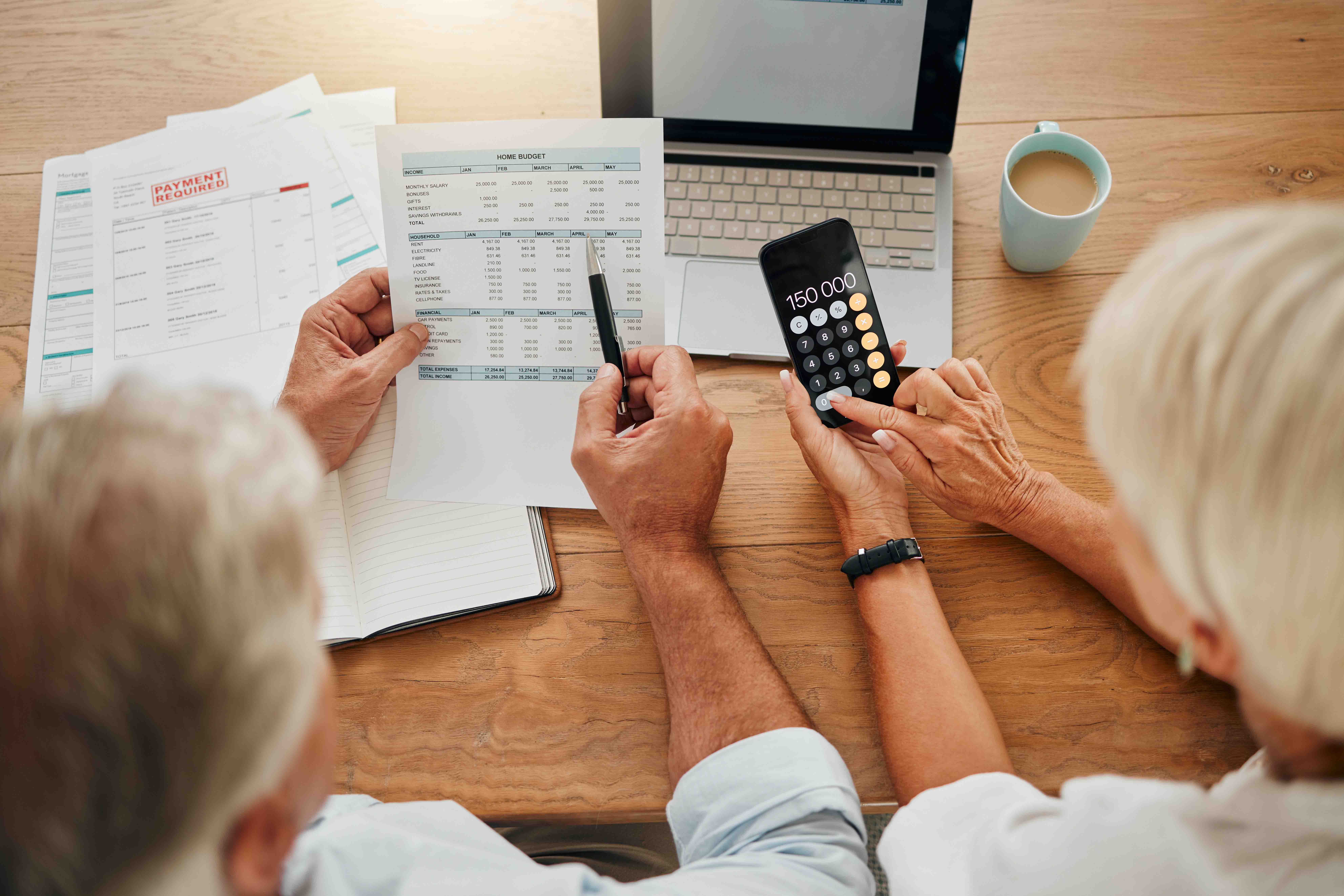 , senior couple calculating their expenses